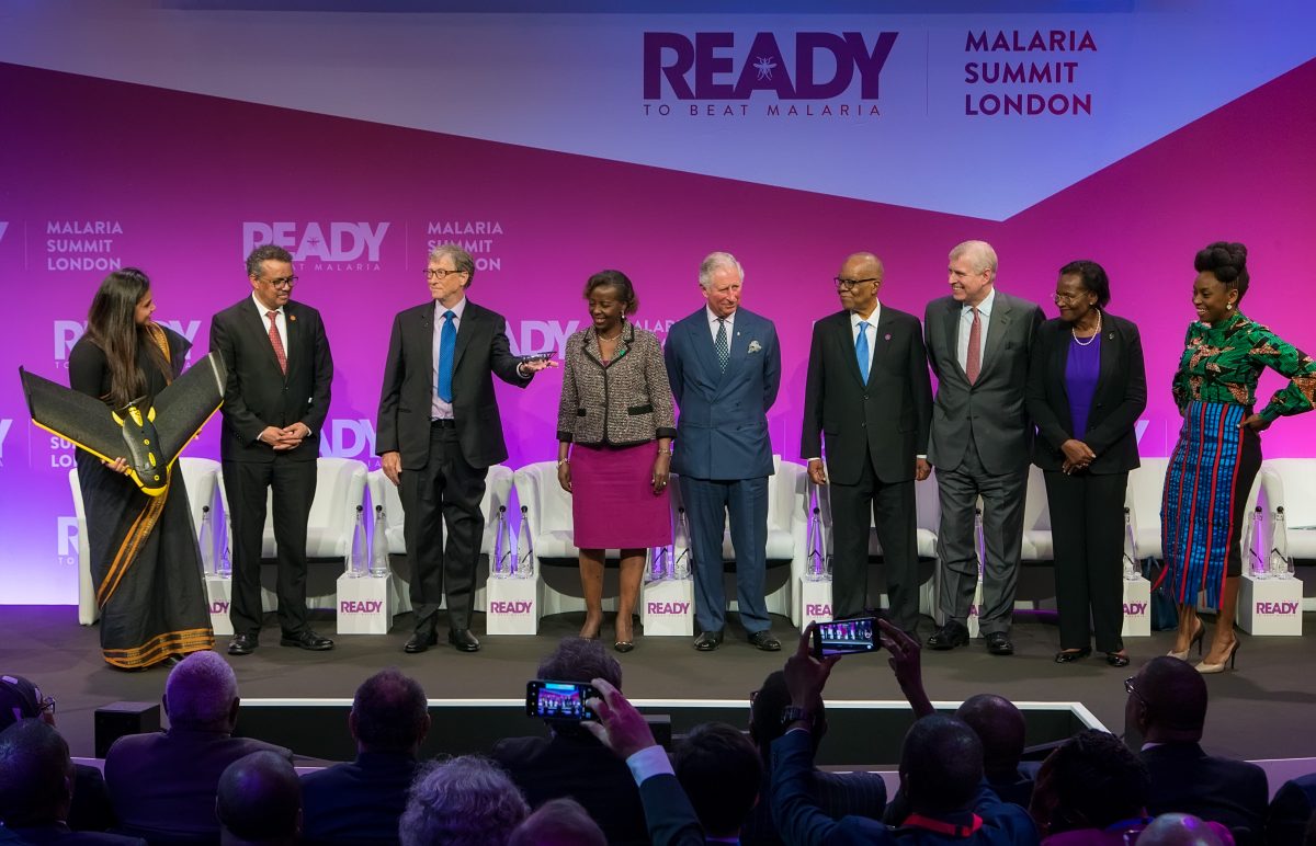 Group of people on stage giving a presentation